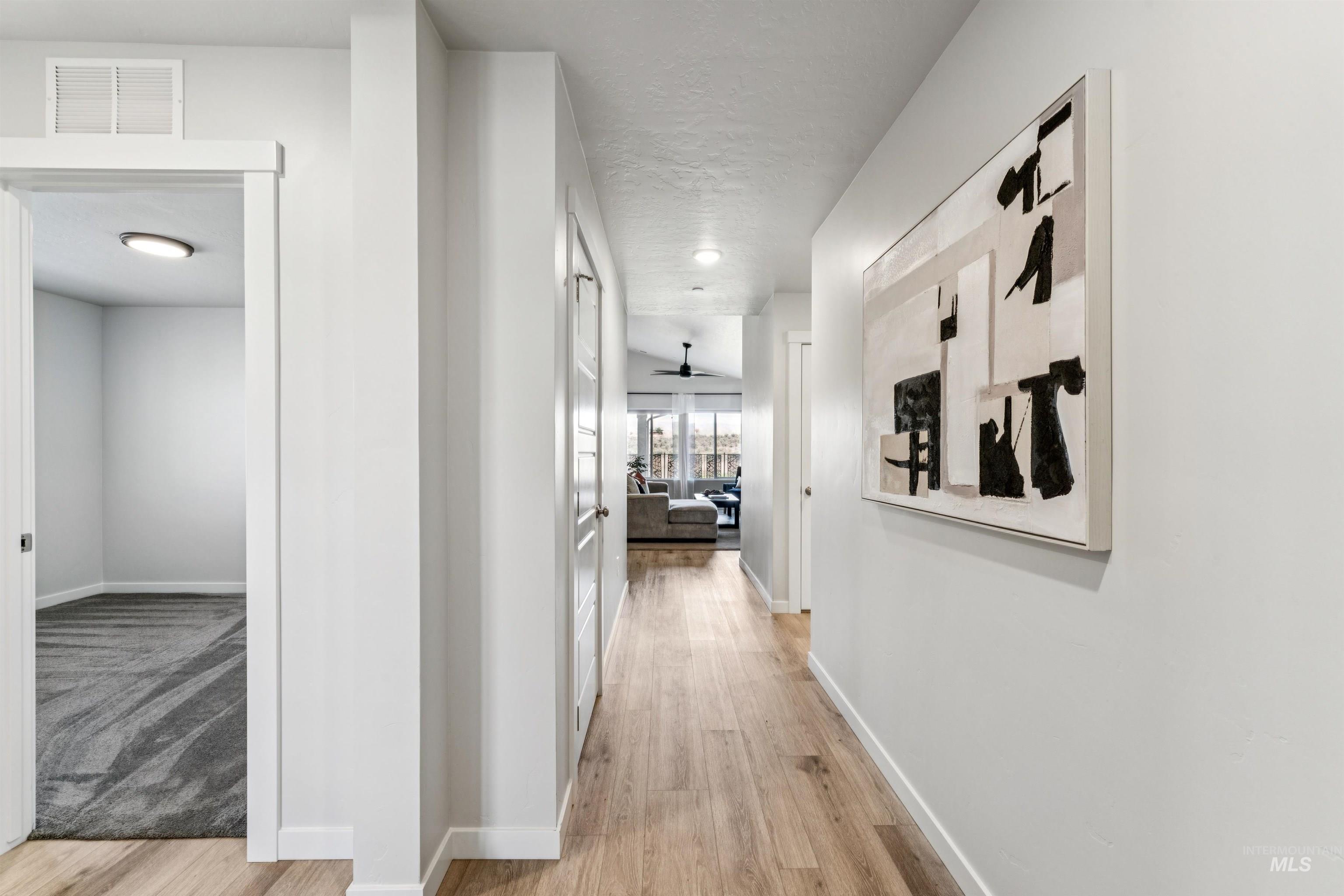 8386 South Bogus Rdg Avenue Boise, ID 83716 - Photo 3 of 50 Hallway with light wood-style flooring
