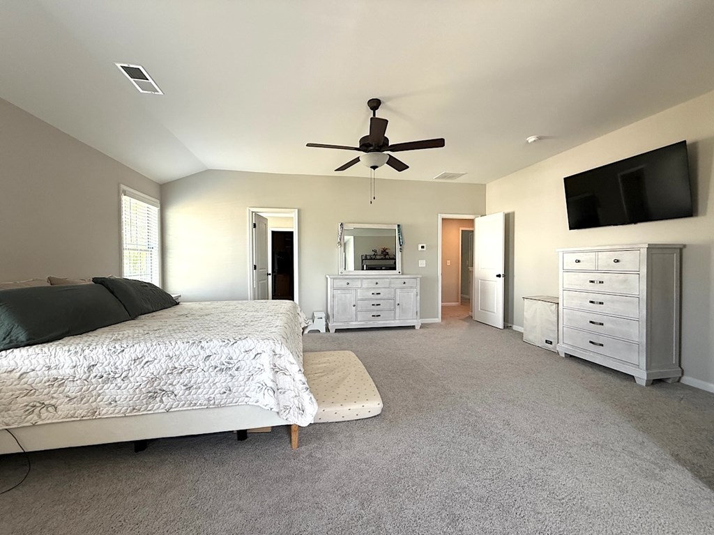 33 Sugar Maple Drive Fort Mitchell, AL 36856 - Photo 18 of 29 a bedroom with a bed and a flat screen tv