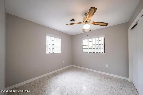 an empty room with windows