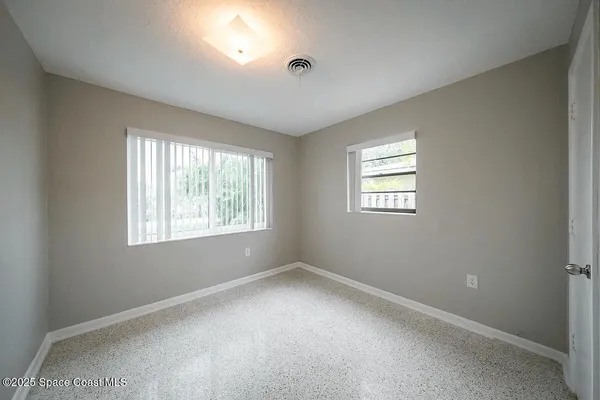 a view of a yard with palm trees