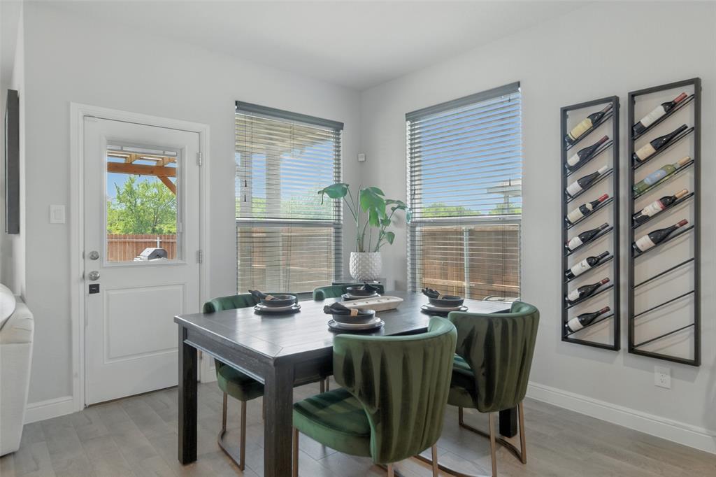 712 Finchley Drive Fort Worth, TX 76247 - Photo 13 of 37 a view of a dining room with furniture window and outside view