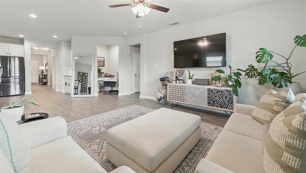 712 Finchley Drive Fort Worth, TX 76247 - Photo 15 of 37 a living room with furniture and a flat screen tv