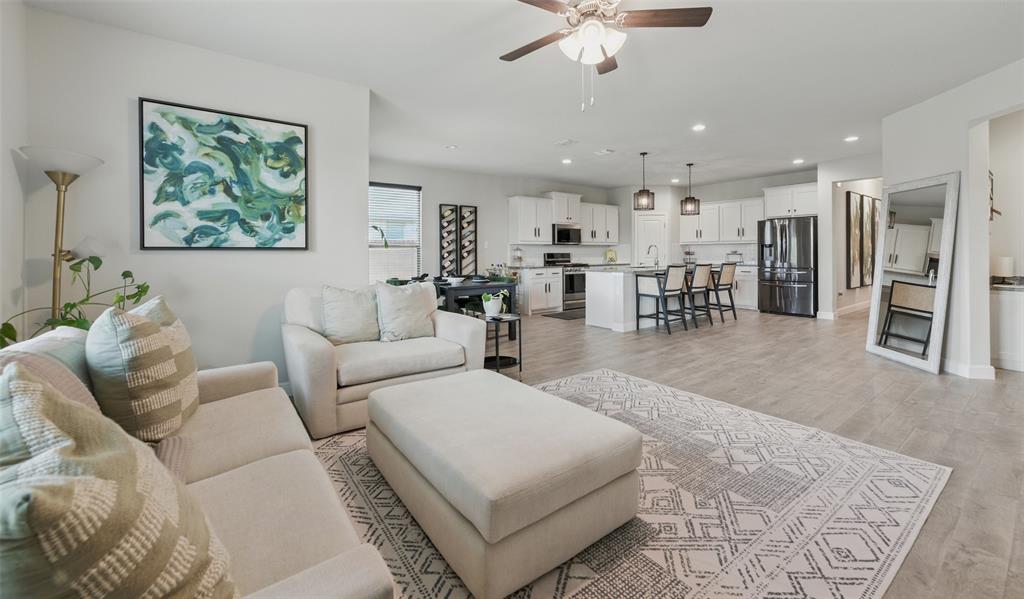 712 Finchley Drive Fort Worth, TX 76247 - Photo 16 of 37 a living room with furniture and a large window