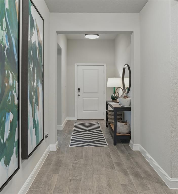 712 Finchley Drive Fort Worth, TX 76247 - Photo 8 of 37 a view of a room with wooden floor