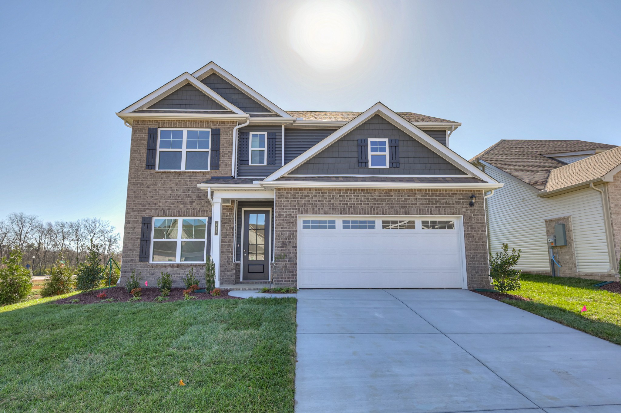 411 Duchess Boulevard, Unit A Gallatin, TN 37066 - Photo 1 of 26 a front view of a house with a yard and garage