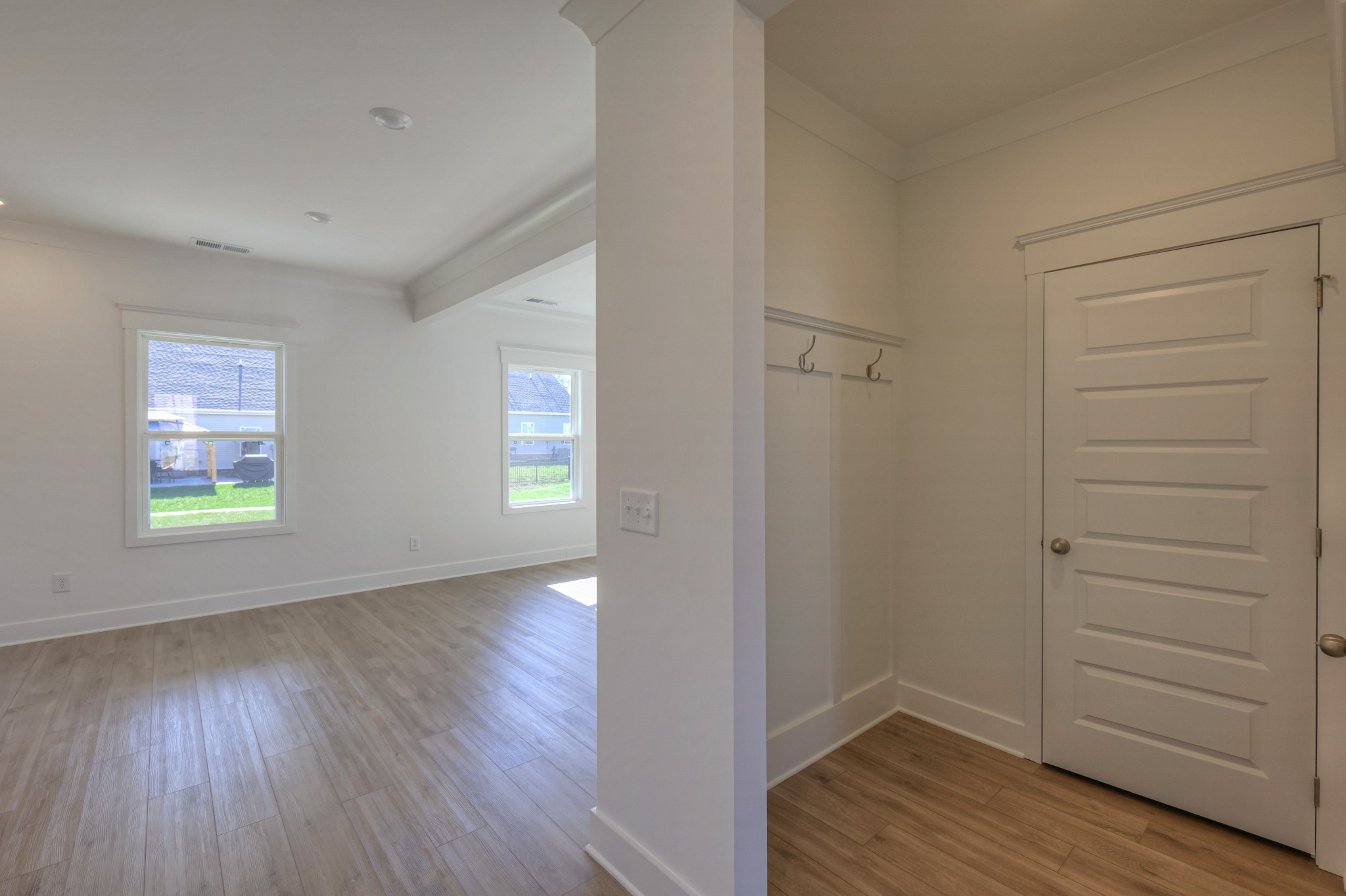 411 Duchess Boulevard, Unit A Gallatin, TN 37066 - Photo 11 of 26 wooden floor in an empty room with a window