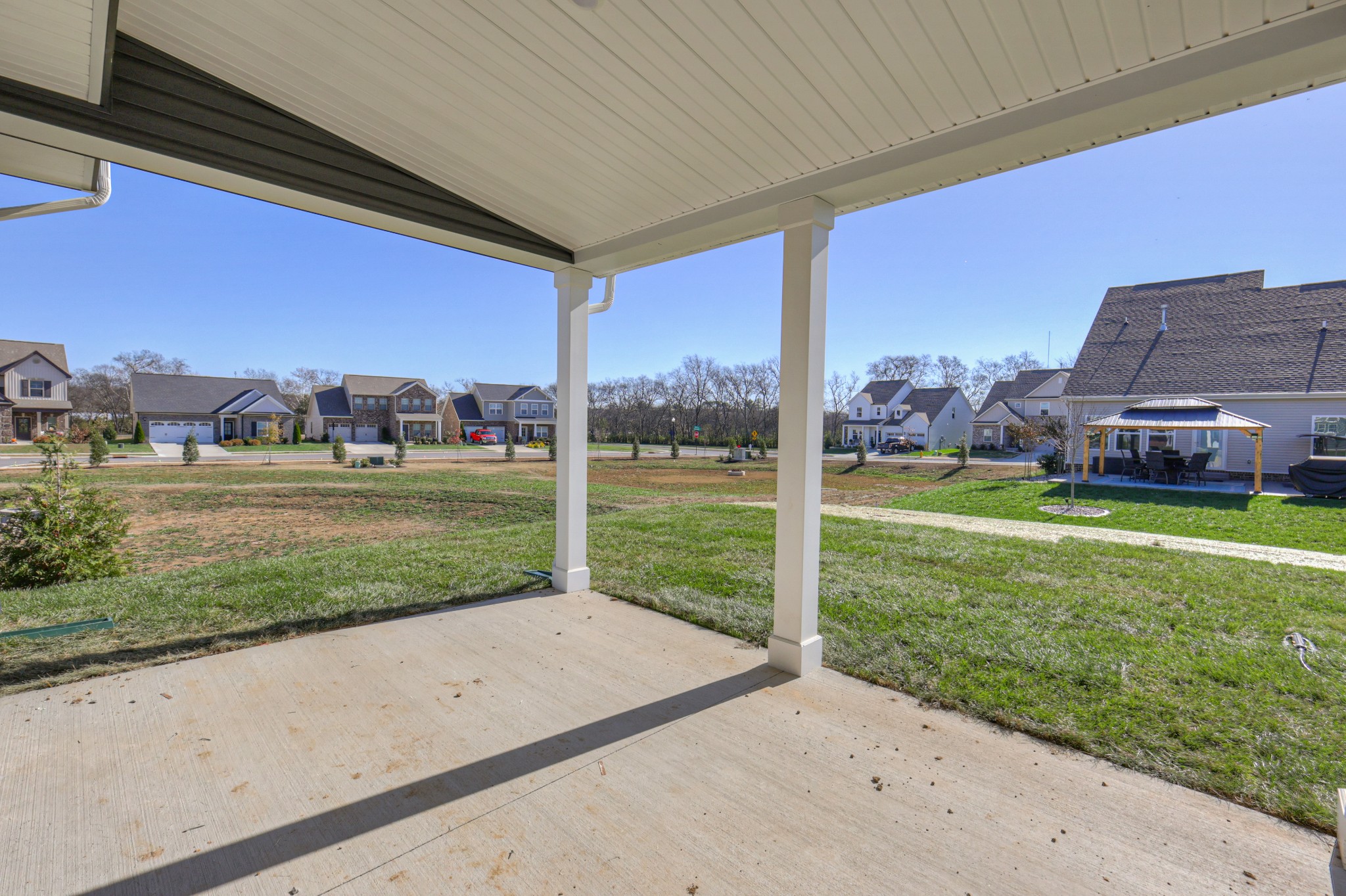 411 Duchess Boulevard, Unit A Gallatin, TN 37066 - Photo 26 of 26 a view of a house with a big yard potted plants and large tree
