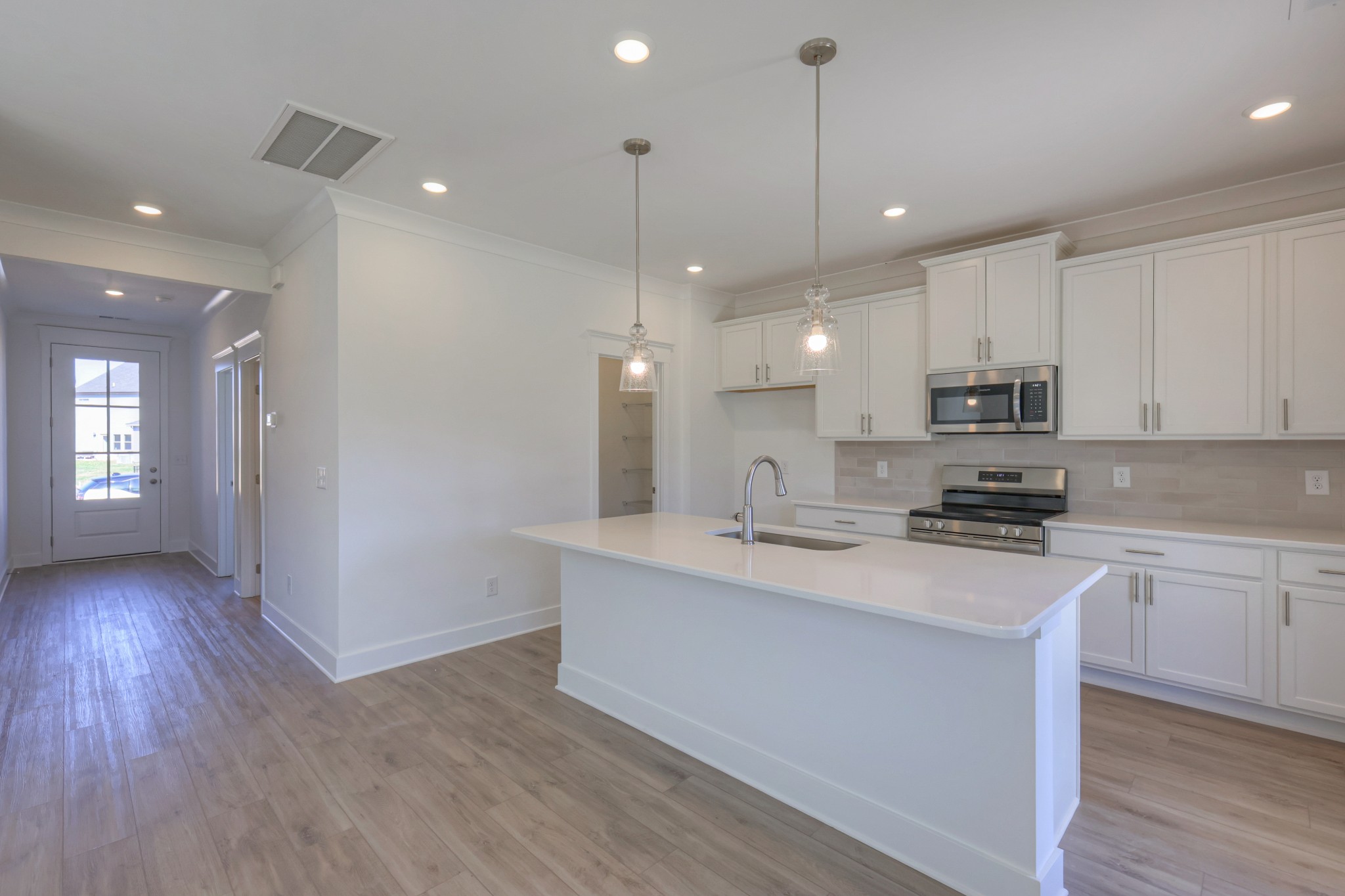 411 Duchess Boulevard, Unit A Gallatin, TN 37066 - Photo 5 of 26 a kitchen with kitchen island a sink stainless steel appliances and cabinets
