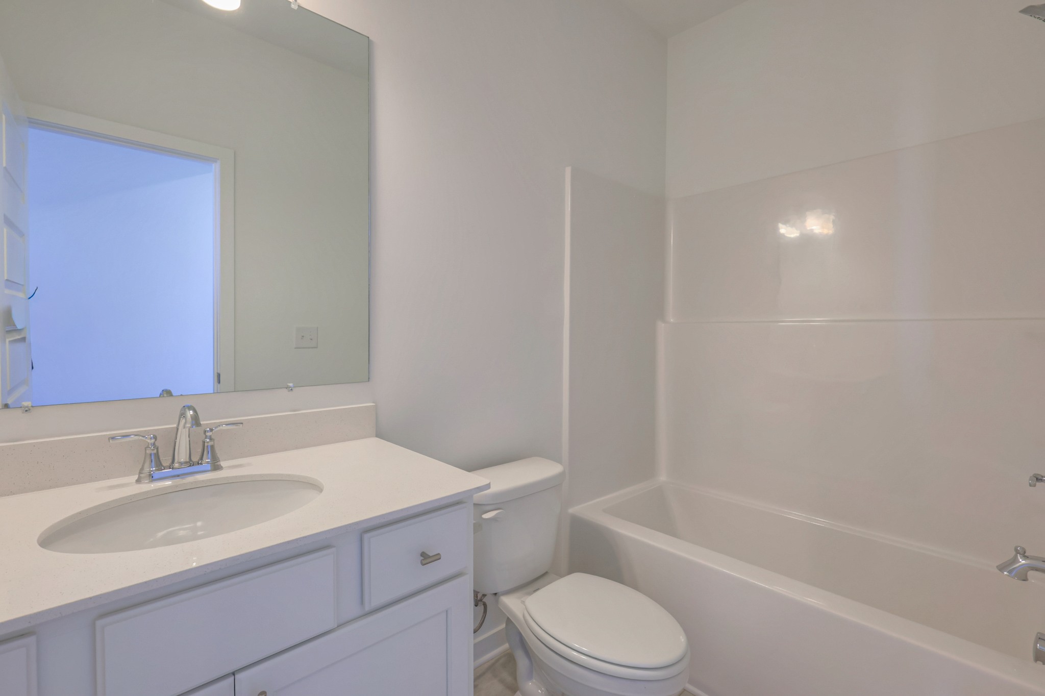 411 Duchess Boulevard, Unit A Gallatin, TN 37066 - Photo 10 of 26 a bathroom with a sink toilet vanity and bathtub