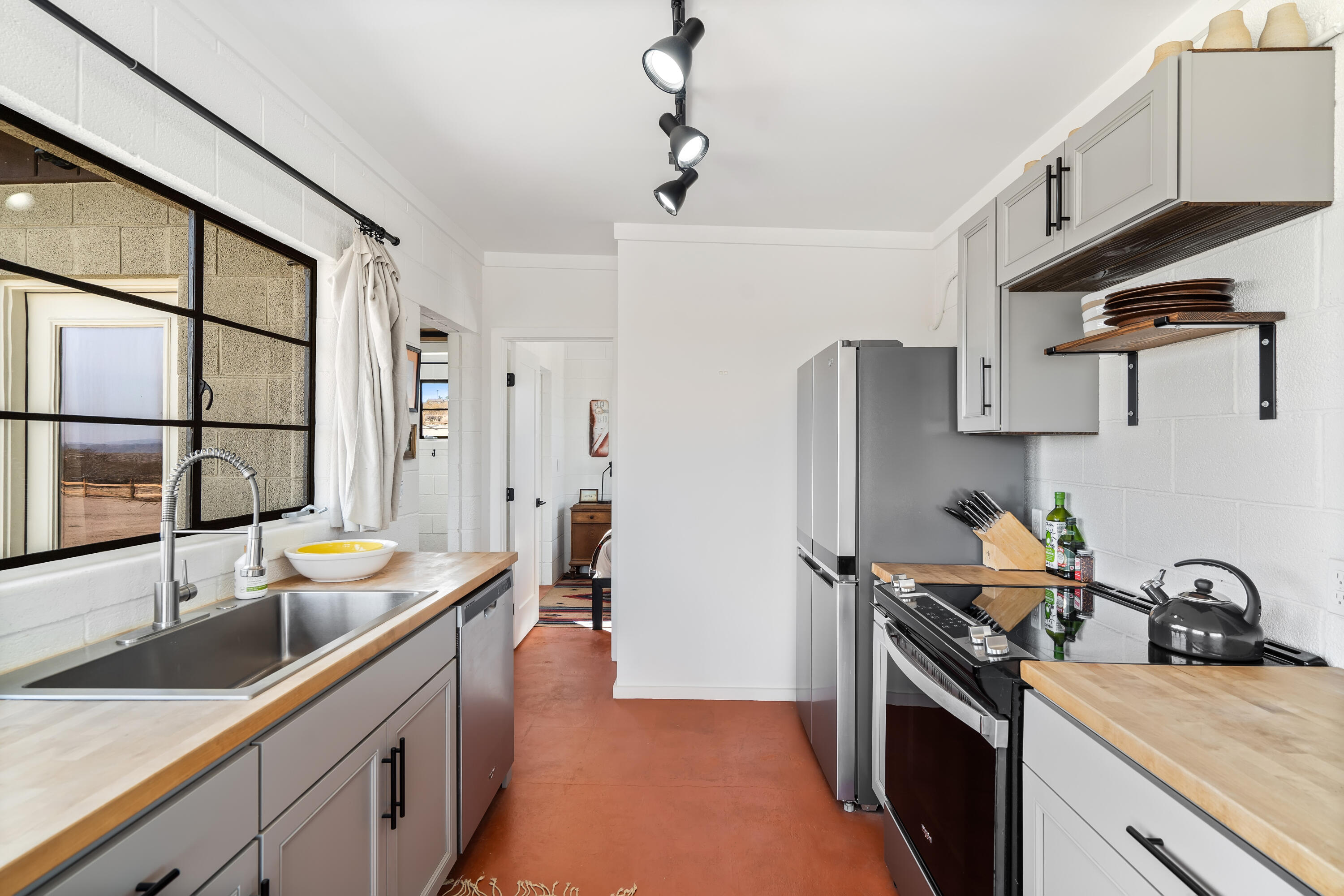 52079 Ocotillo Road Johnson Valley, CA 92285 - Photo 15 of 40 a kitchen with a sink stove and refrigerator