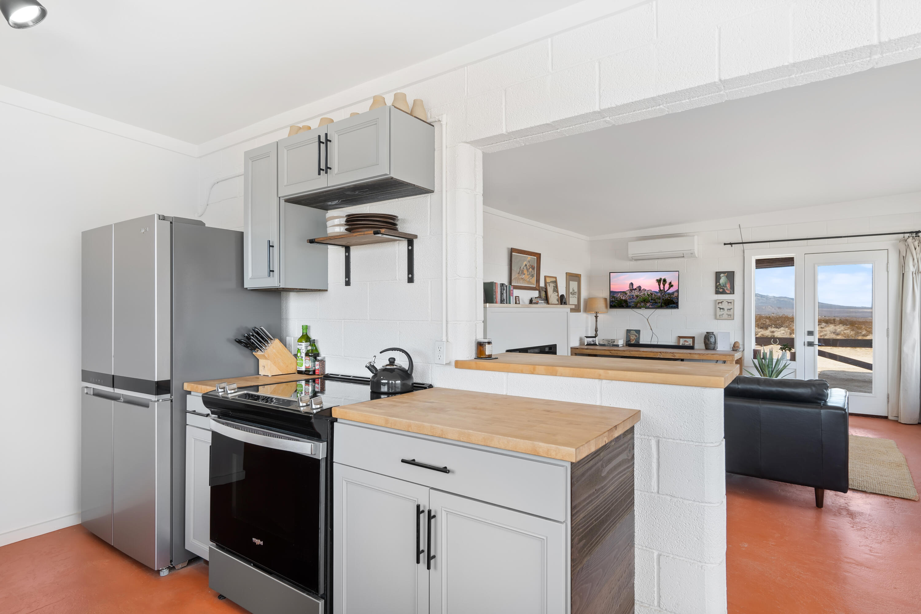 52079 Ocotillo Road Johnson Valley, CA 92285 - Photo 16 of 40 a kitchen with stainless steel appliances a sink stove and refrigerator