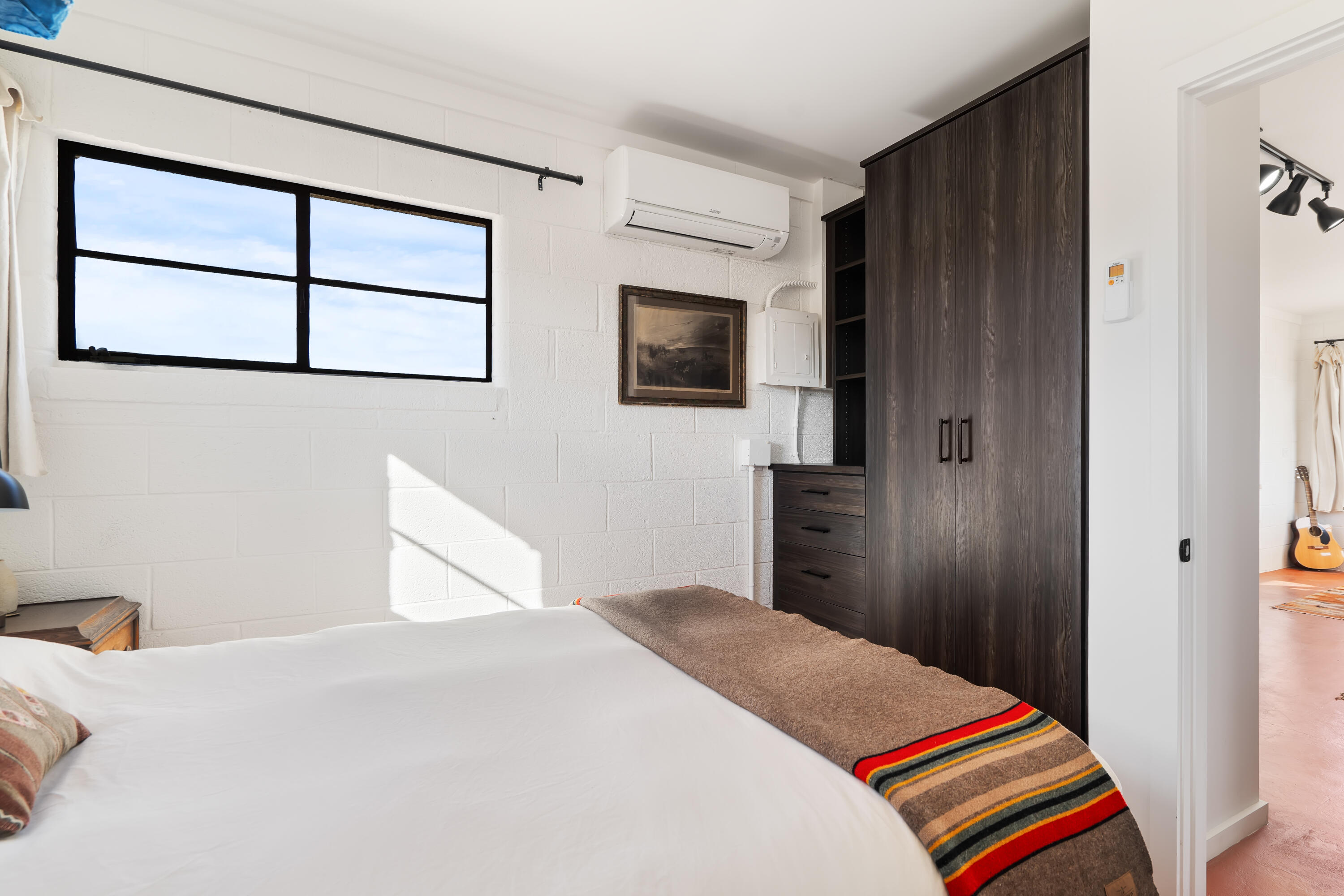 52079 Ocotillo Road Johnson Valley, CA 92285 - Photo 23 of 40 a bedroom with a bed and a flat screen tv