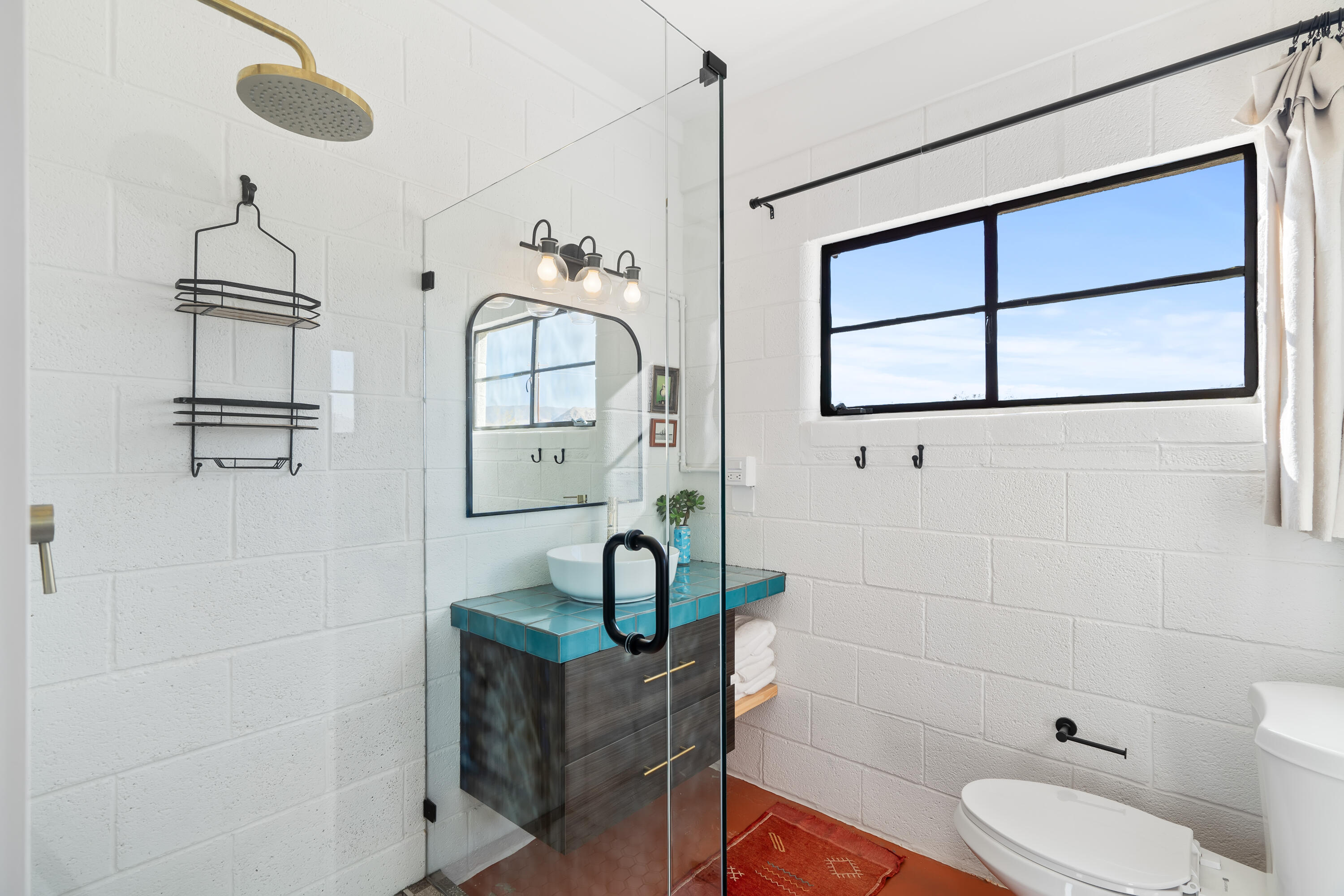 52079 Ocotillo Road Johnson Valley, CA 92285 - Photo 27 of 40 a bathroom with a toilet a sink and mirror
