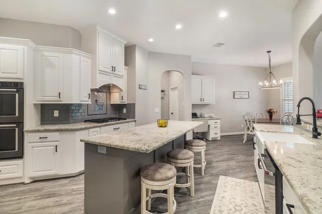 a large kitchen with lots of counter space and appliances