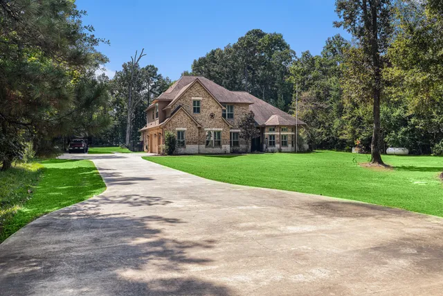 a front view of a house with yard