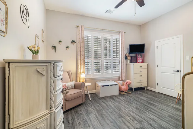 a bedroom with furniture and a window