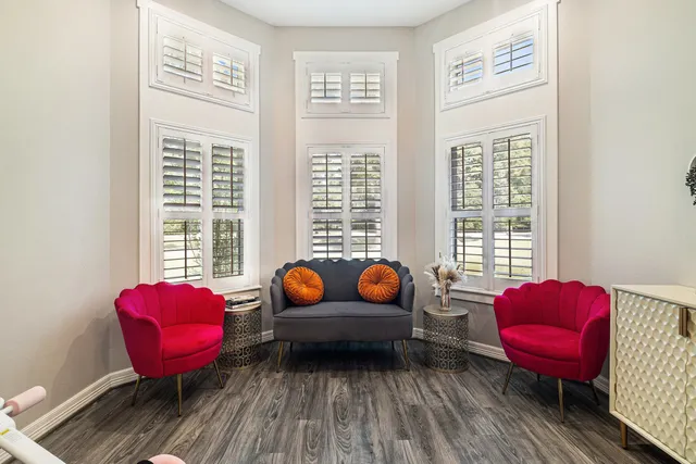 a living room with furniture a table and a window