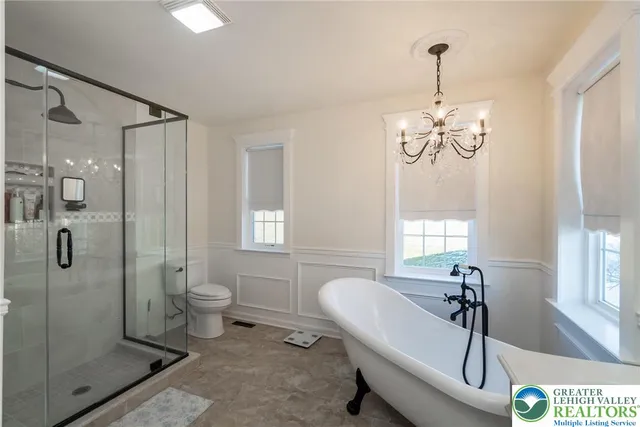 a living room with furniture and a mirror