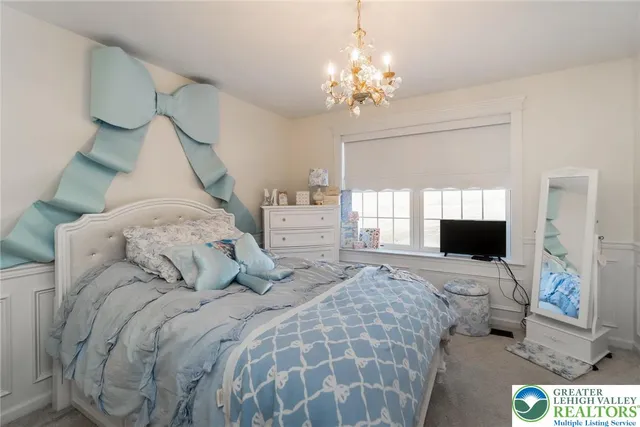 a view of a house with swimming pool and sitting area