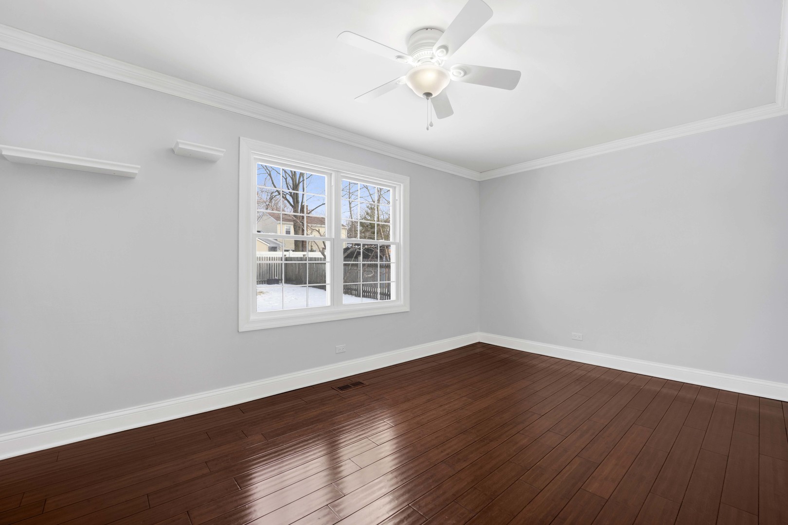 332 South River Road Naperville, IL 60540 - Photo 24 of 41 a view of an empty room with wooden floor and a window