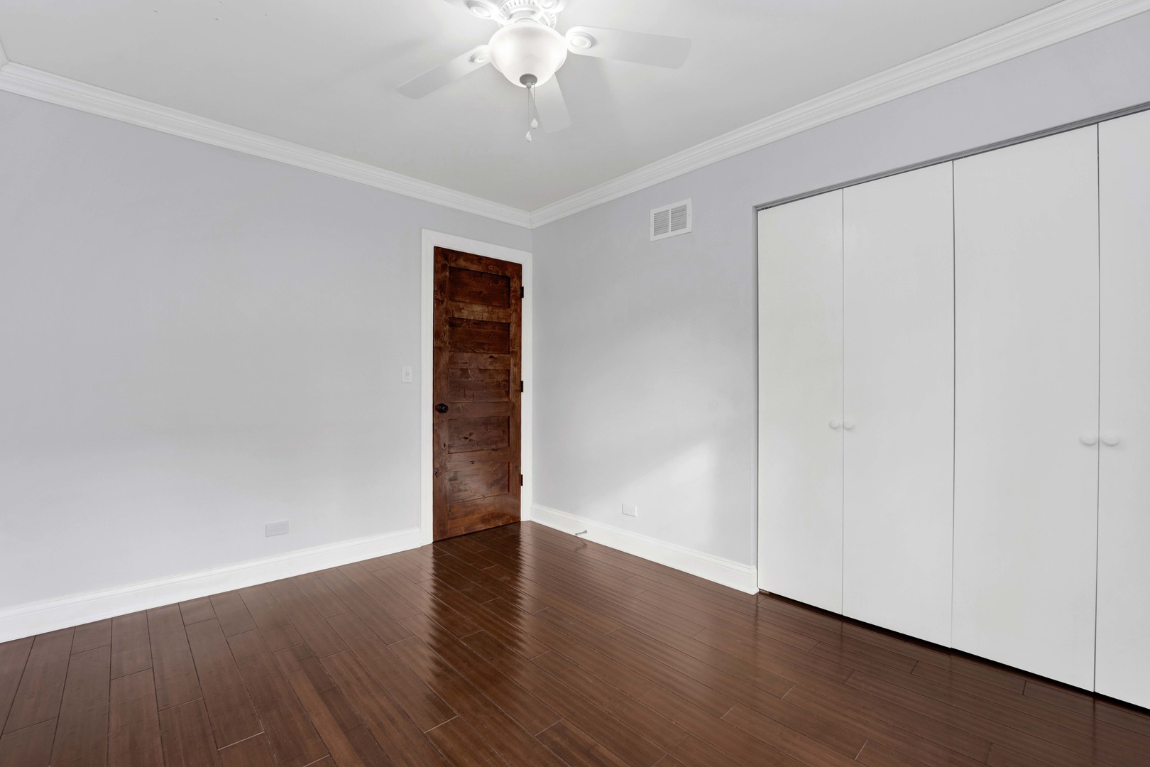 332 South River Road Naperville, IL 60540 - Photo 28 of 41 a view of an empty room with wooden floor and a window