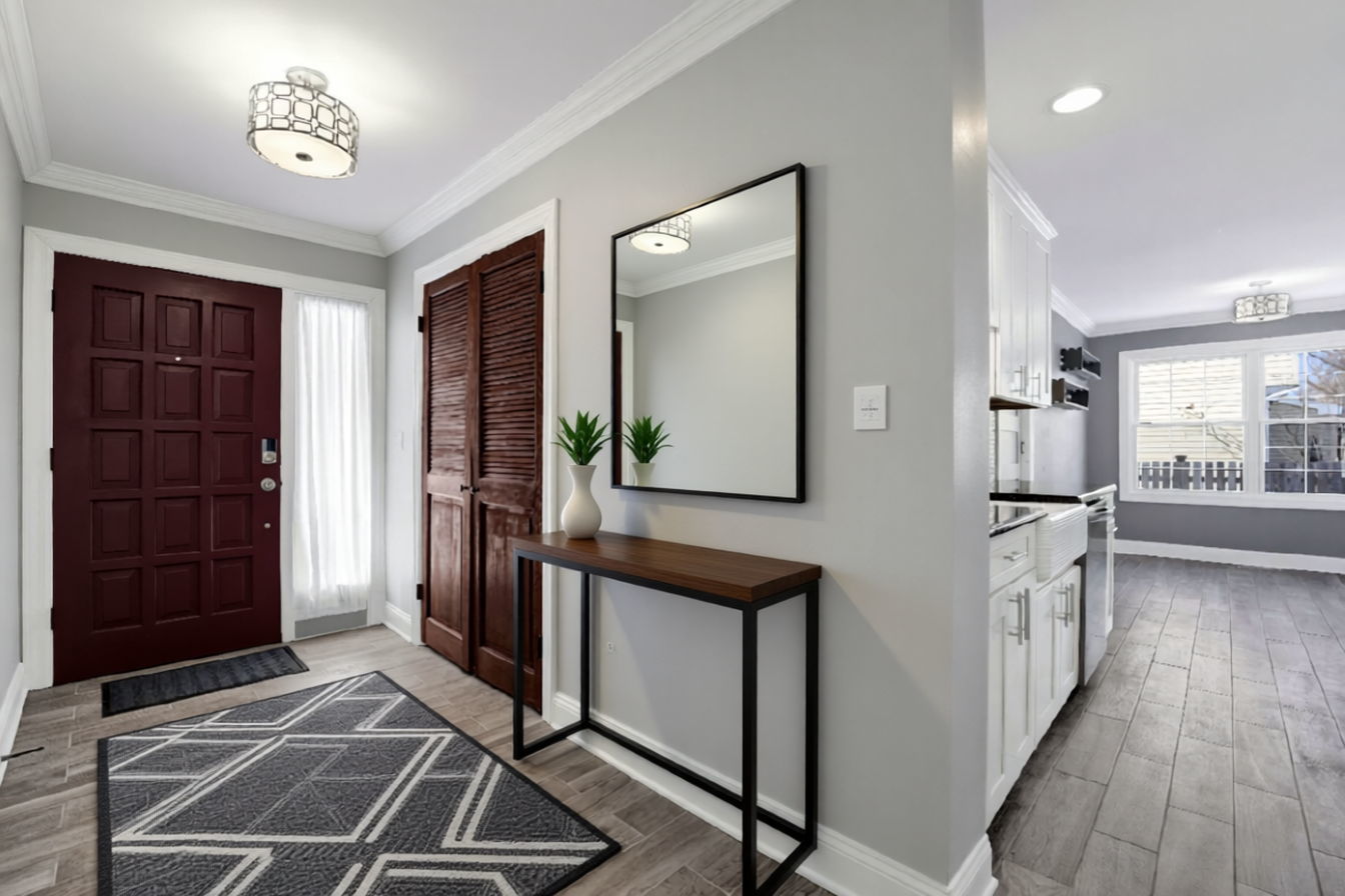 332 South River Road Naperville, IL 60540 - Photo 4 of 41 a view of a kitchen with a sink and a refrigerator