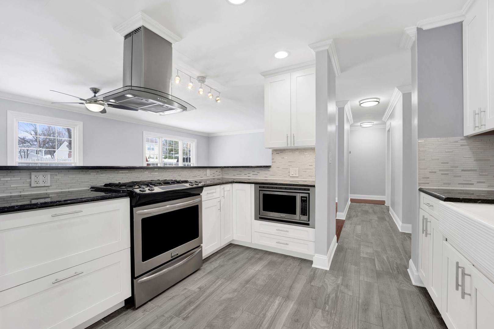 332 South River Road Naperville, IL 60540 - Photo 6 of 41 a kitchen with granite countertop stainless steel appliances a stove cabinets and wooden floor