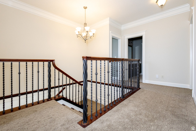 434 Cardon Ridge Drive Smithfield, UT 84335 - Photo 17 of 59 Stairway featuring ornamental molding, carpet flooring, and a chandelier