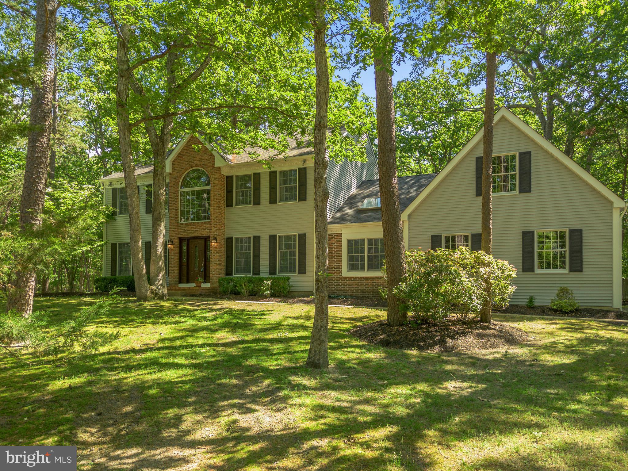 581 McKendimen Road Medford, NJ 08055 - Photo 3 of 34 a front view of a house with a garden