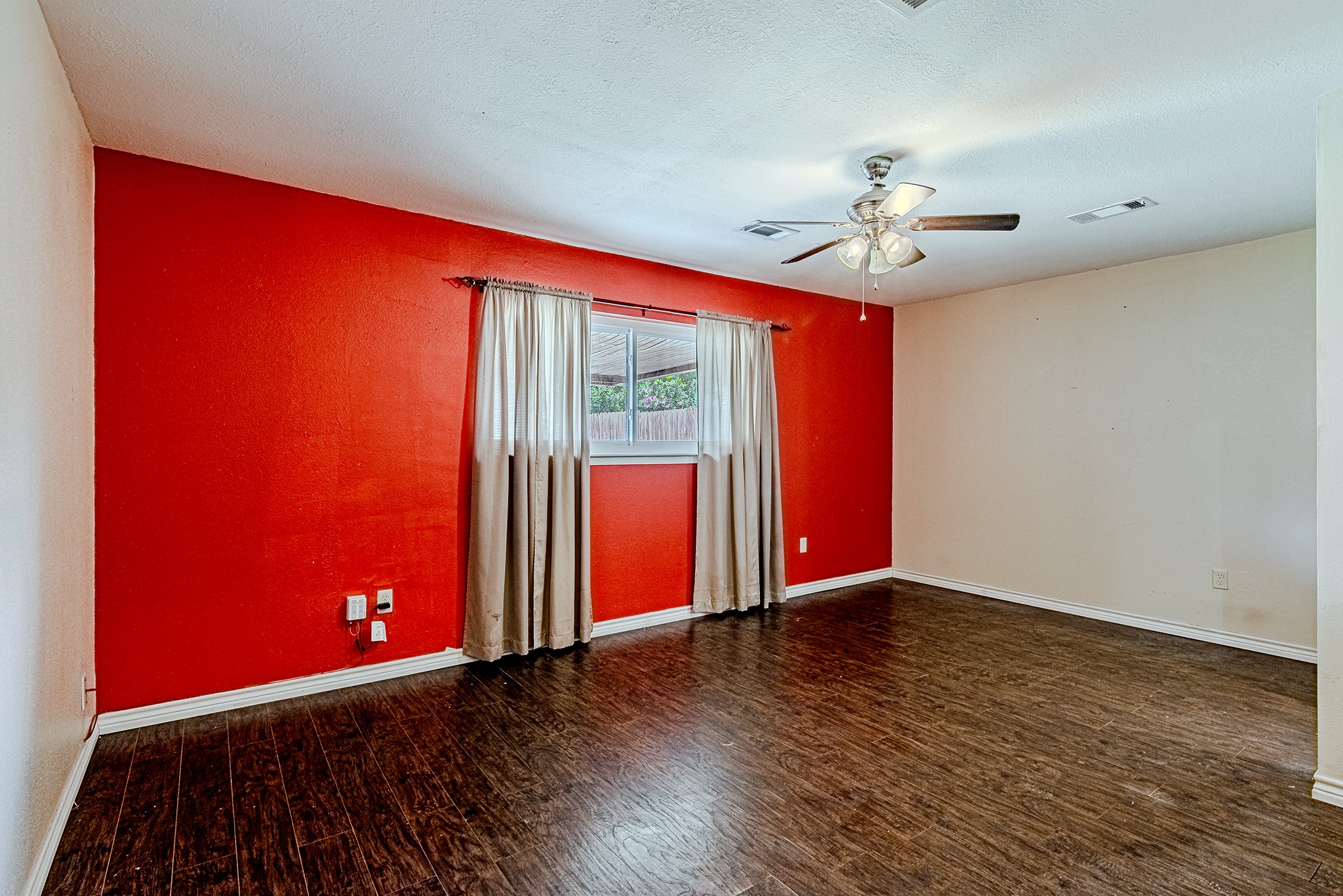 2710 Burke Road Pasadena, TX 77502 - Photo 15 of 28 Primary bedroom view showing the accent wall and spacious layout