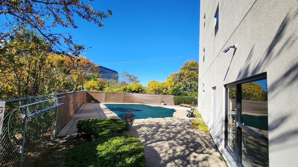 133 Commander Shea Boulevard, Unit 502 Quincy, MA 02171 - Photo 11 of 12 a view of a house with a garden