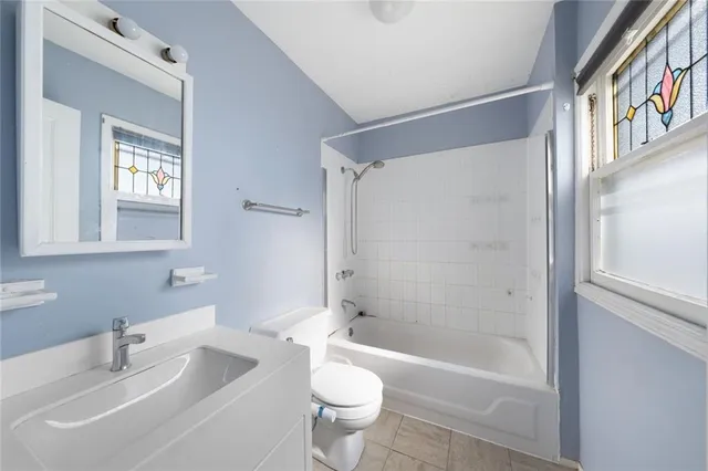 a bathroom with a sink a toilet and a bathtub