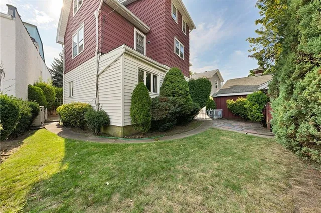 a view of a house with a yard and plants