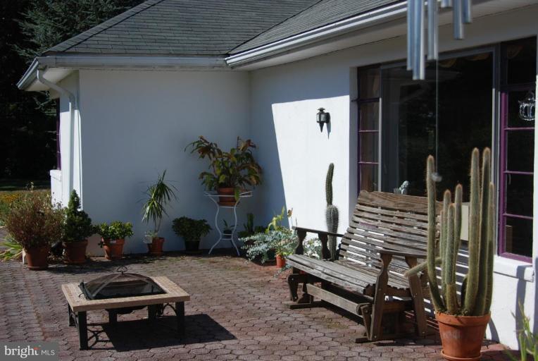 5716 Etzler Road Frederick, MD 21702 - Photo 22 of 29 a outdoor space with a couch and potted plant