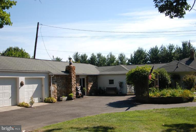 5716 Etzler Road Frederick, MD 21702 - Photo 4 of 29 a front view of a house with garden