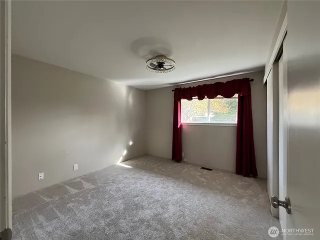 a view of an empty room and window