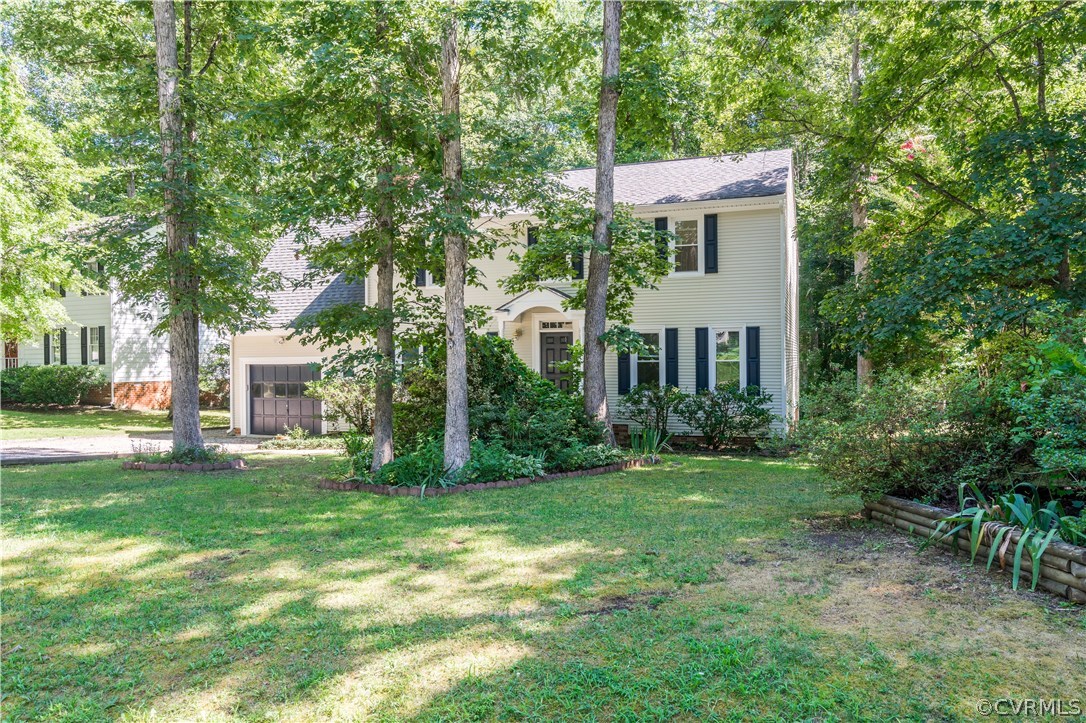 13107 Queensgate Road Midlothian, VA 23114 - Photo 33 of 34 a front view of a house with a garden