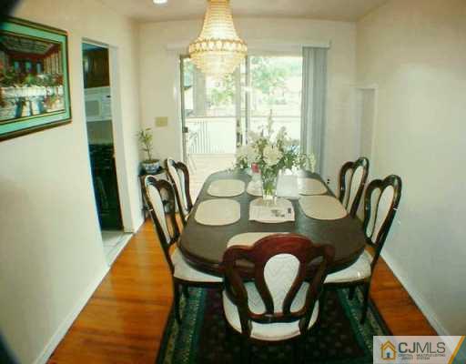 35 Mercer Road Old Bridge, NJ 08857 - Photo 3 of 8 a view of a dining room with furniture and wooden floor