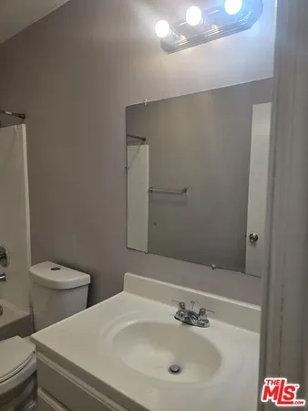 a bathroom with a sink and a toilet
