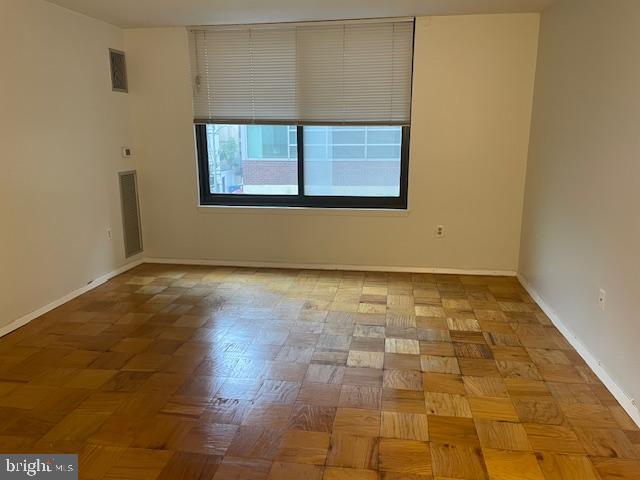 1301 20th Street Northwest, Unit 316 Washington, DC 20036 - Photo 1 of 9 a view of a room with wooden floor and a window