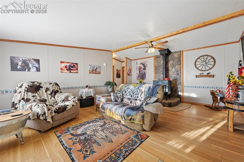 35875 Shear Road Yoder, CO 80864 - Photo 14 of 45 a living room with furniture and wooden floor