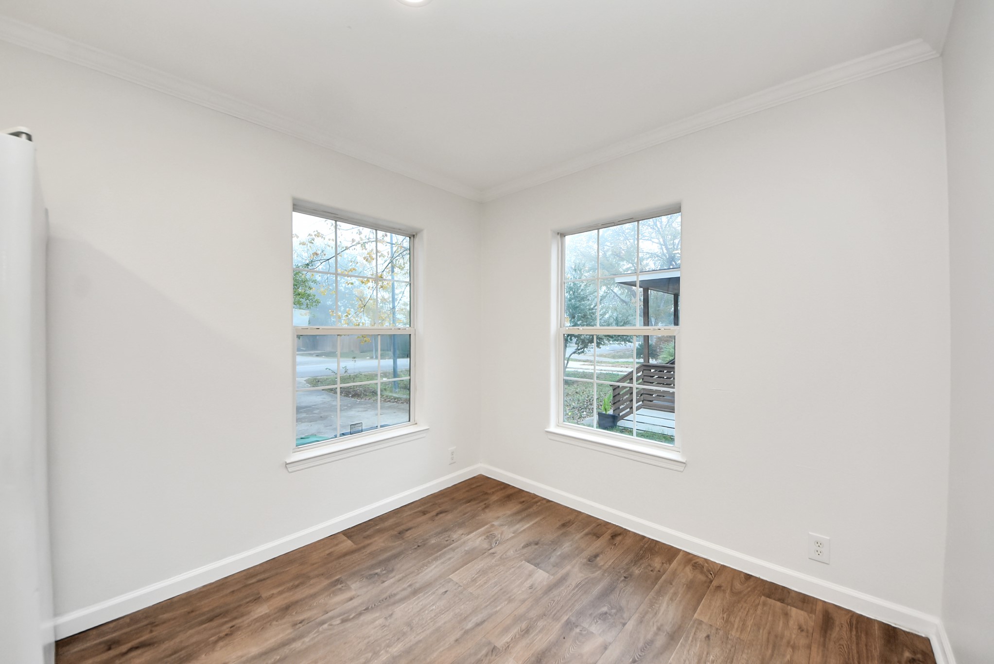 6526 Carver Road, Unit A Houston, TX 77091 - Photo 16 of 31 an empty room with wooden floor and windows