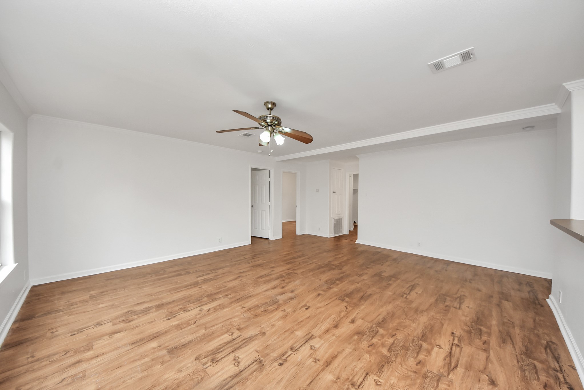 6526 Carver Road, Unit A Houston, TX 77091 - Photo 2 of 31 a view of an empty room with a chandelier fan