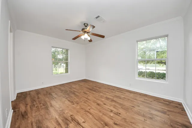 a view of an empty room with a window