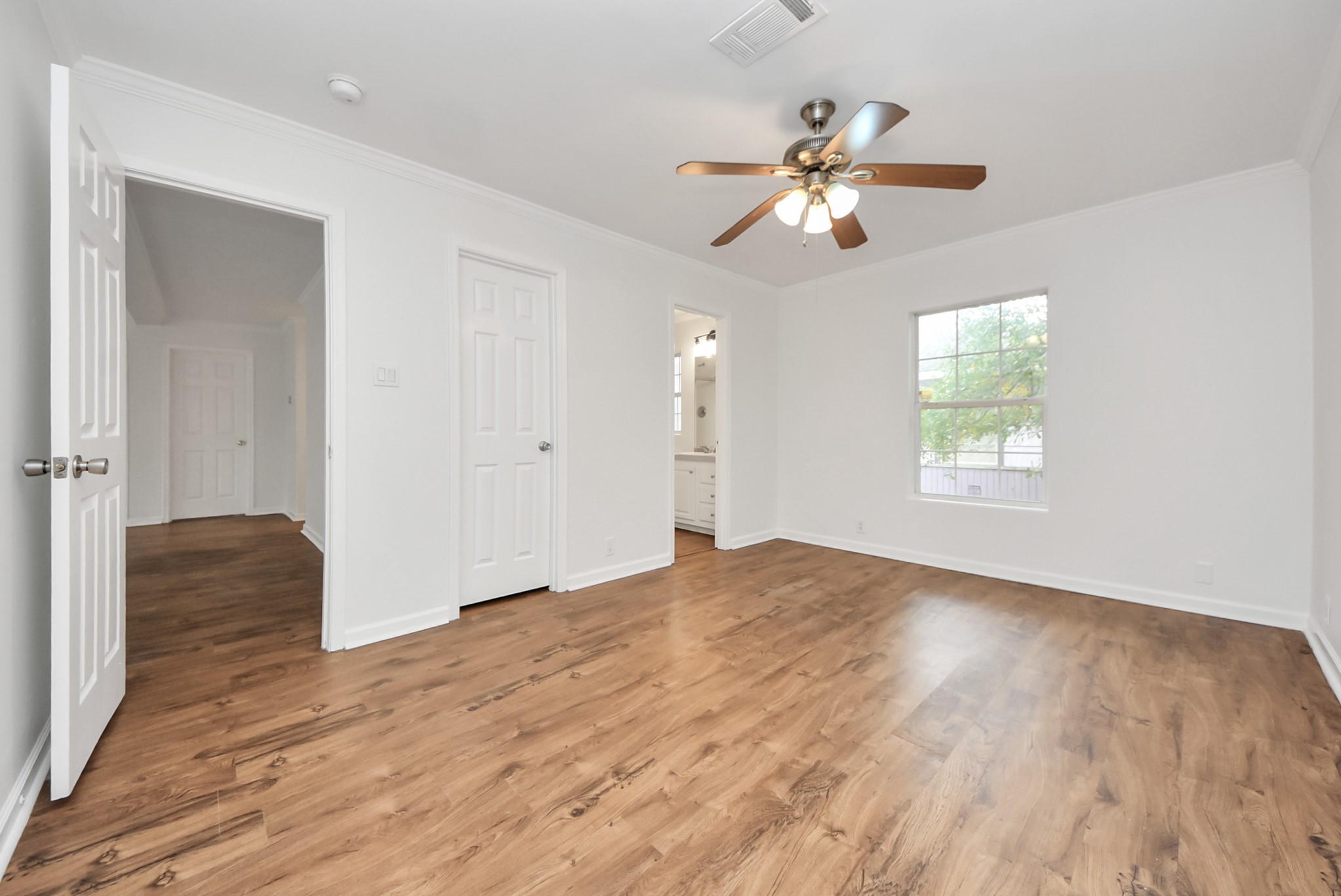 6526 Carver Road, Unit A Houston, TX 77091 - Photo 24 of 31 wooden floor in an empty room with a window