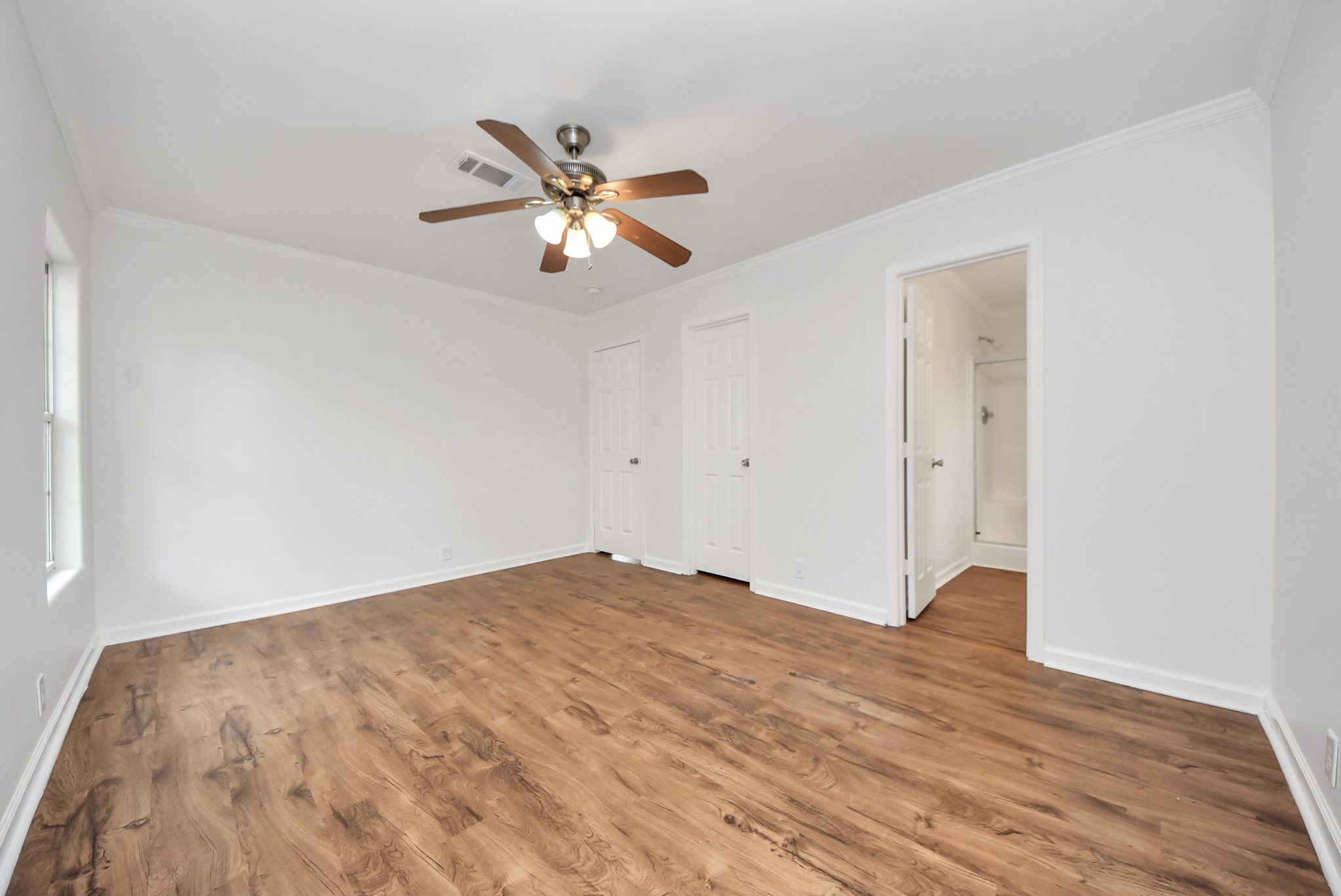 6526 Carver Road, Unit A Houston, TX 77091 - Photo 25 of 31 a view of empty room with wooden floor