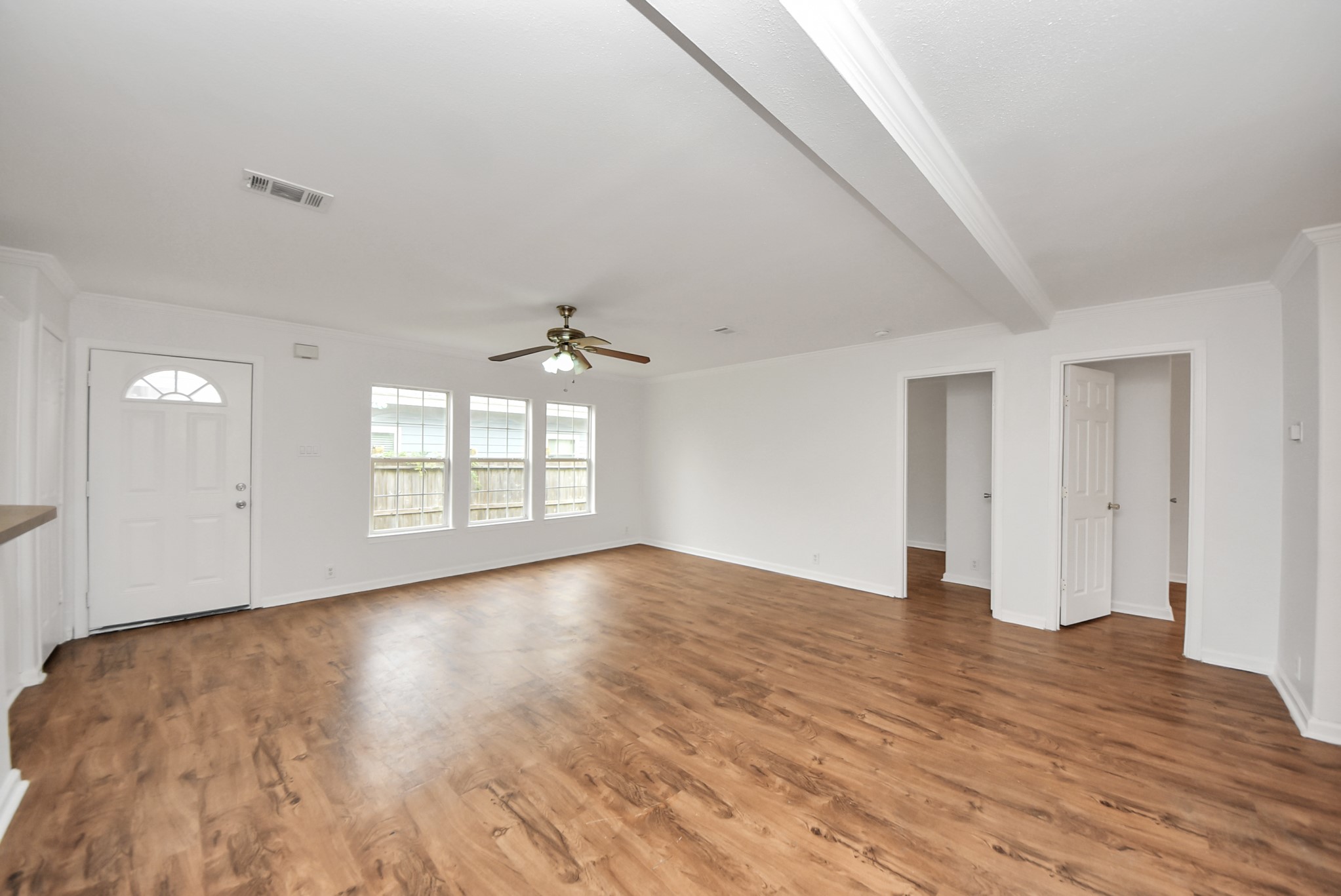 6526 Carver Road, Unit A Houston, TX 77091 - Photo 3 of 31 wooden floor in an empty room with a window
