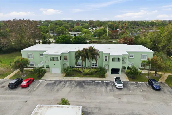 an aerial view of residential houses with outdoor space