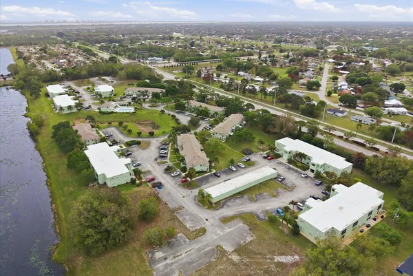an aerial view of residential houses with outdoor space