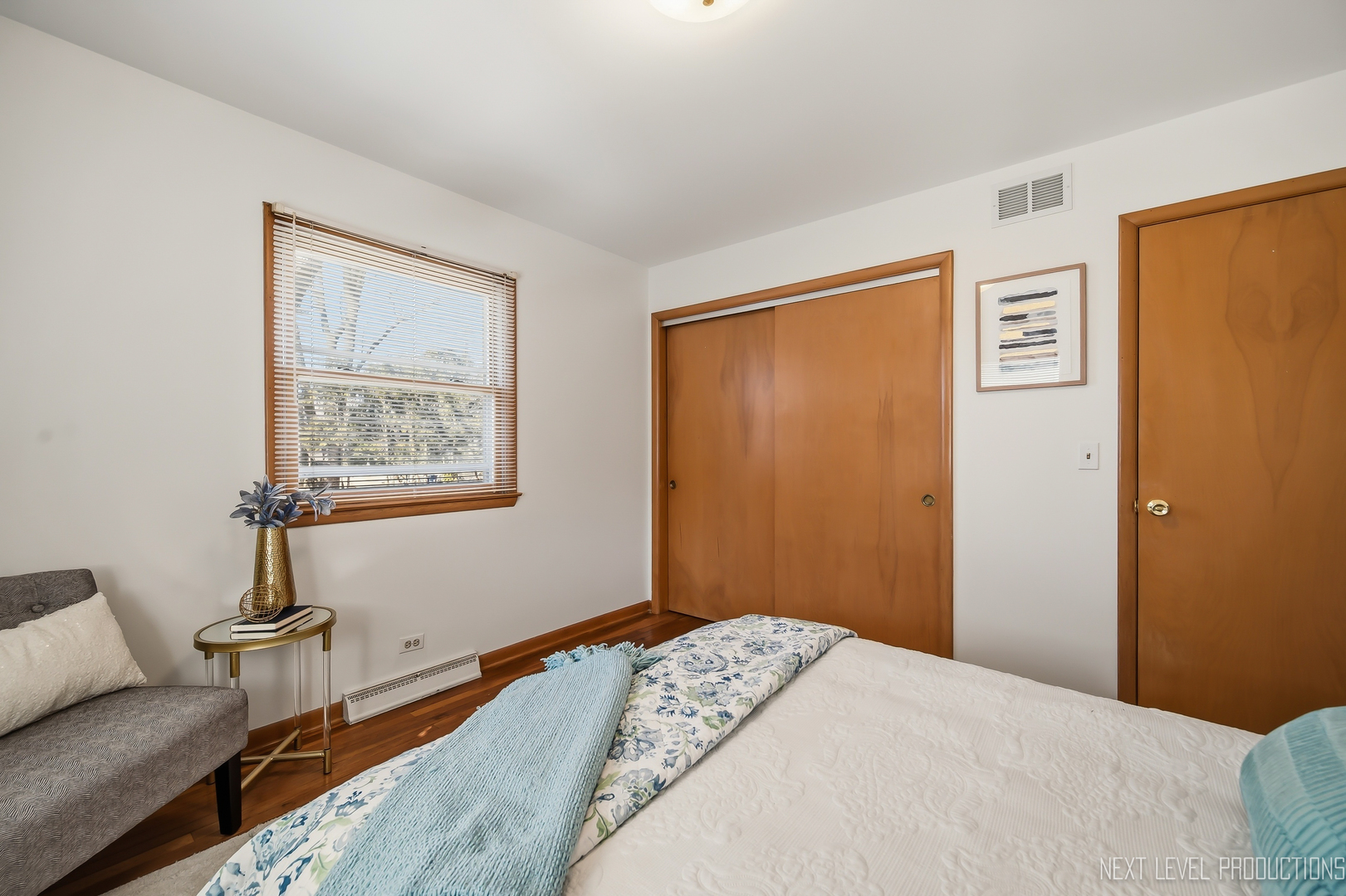 906 Carol Avenue Elgin, IL 60123 - Photo 11 of 31 a bedroom with a bed and a couch